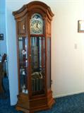 Beautiful Howard Miller grandfather/curio cabinet clock.