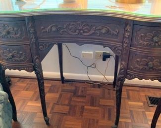 Antique carved wood desk, kidney shaped top with glass cover $225