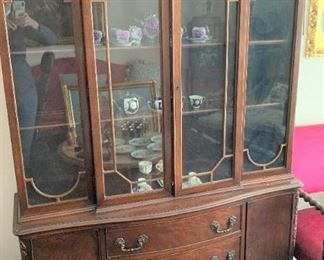 China cabinet. Measures 76 1/2" high by 48 1/4" wide by 14 1/2" deep.  $175