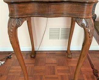 Carved wooden side table with claw feet. Measures 27" tall by 18 1/2" square.  $100