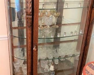 Antique oak cabinet with glass shelves and claw feet $350