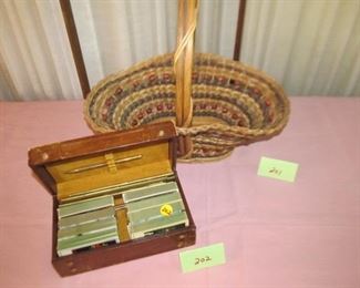 201 Handled basket, $10; 202 Leather card box w/ cards sold