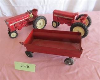 243 Pair of IH tractors and wagon $18