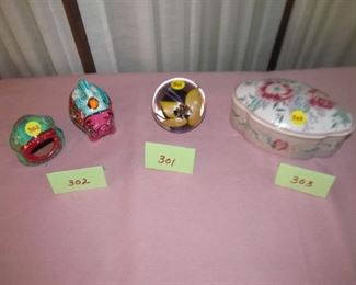 301 Paperweight $10;  302  two Mexican figurines $5;  303 lidded dish $6