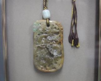 Hanging jade pendant.
