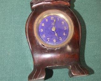 $15. Blue face, wooden case clock. 5.5 inch high.