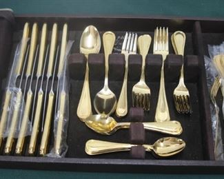 $60. Gold colored stainless flatware set. 58 pieces.
