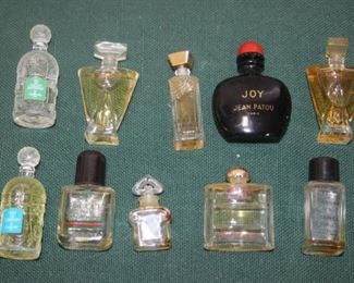 $15. miniature perfume bottles (10), some full.