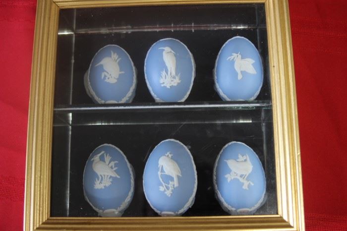 $50. Set of 6 Wedgwood Blue eggs in a gold colored shadow box. 9x9. Black felt shelf and mirrored shelf.