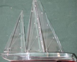 50% OFF, now $12.50.                                                                   
$25. Signed Lucite sailboat. Red hull. 14.5x11.