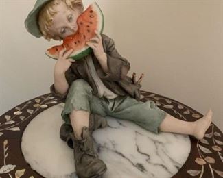 $50.00......Giuseppe Cappe Italian Bisque Porcelain Figurine Boy eating Watermelon Italian Works of Art.  7" tall very good condition no chips.