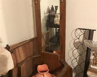 Nice slender Oak hall tree with lift up seat for storage.  Notice wire shelf