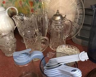 Measuring  cups and spoons and syrup bottle to match