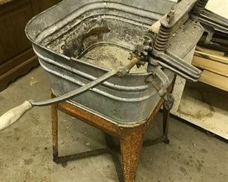 Galvanized wash tub on Stand.  Wringer and it works