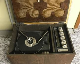 Unusual stereo and radio in cabinet on casters