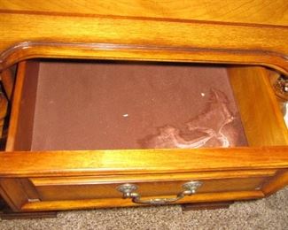 One nightstand has staining inside drawer and watermarks on top