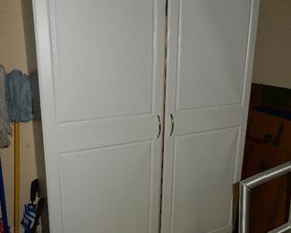 $80    2 door tall cabinet