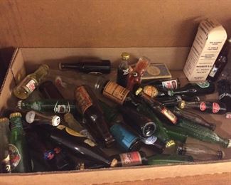 Miniature beer and soda bottles.