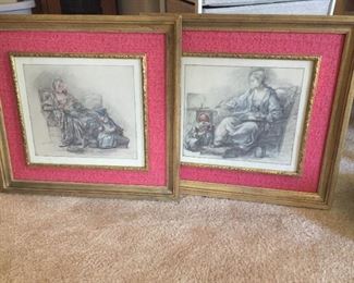 Matching framed black and white drawings.