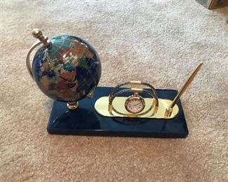 Globe and clock and pen holder.