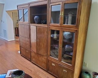 3 piece Drexel storage units! Wonderful! First piece, left,  pull down bar, silver storage drawer, & more storage. Mid section, tv or similar storage, third piece mostly glass display display.  Love this. Each section 80 x 20 x 32. Pecan!