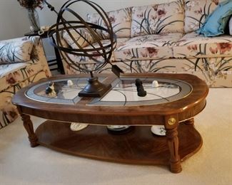 Glass top oval walnut coffee table