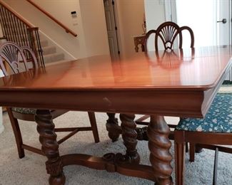 Antique square mahogany dining table with carved legs and base