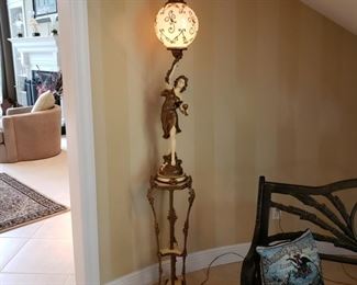 Lighted figural pedestal lamp