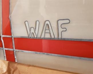 Initials of the decedent on the art glass window