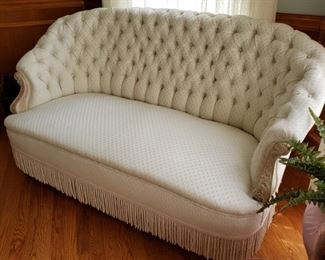 Antique tufted settee passed through the Anheuser family