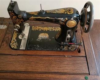 Matchless vintage sewing machine in oak cabinet