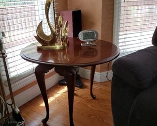 Mahogany dropleaf table and a brass swan lamp