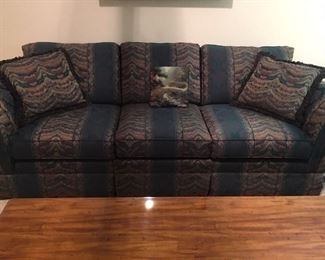 Gem toned couch, deep green