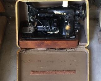 Several antique sewing machines.