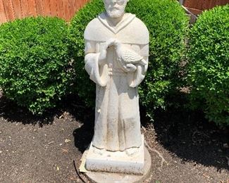$100 - Large outdoor stone sculpture of St. Francis.