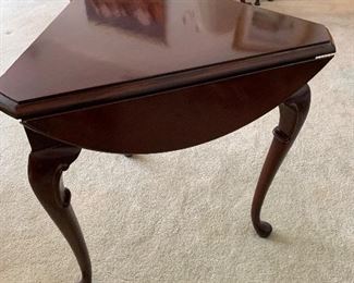 side flip down to form a triangularly shaped table