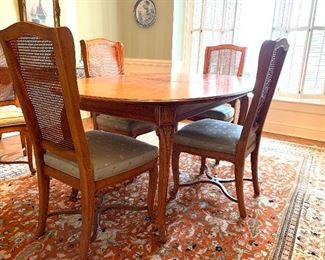 Beautiful Henredon dining table w/6 cane back chairs, 2 leaves and pads $1600.00 30"h X 43"w X 65" each leaf 20"w