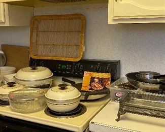 Assorted Kitchen Items Pyrex Casserole Dishes, Heavy Aluminum Pots, Brita Pitcher, Casserole Dish with Silver Plated Stand, Flatware