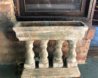 one of a pair of terra-cotta planters