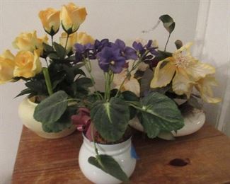 Lot 29 - Three decorative plastic flowers in vase's $20.00 