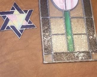 LOT S 138 - $40 - SET OF TWO STAINED GLASS PIECES (FLOWER IS 16" X 9 1/2", STAR OF DAVID IS 7")