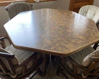45. 1970's Custom Made Octagon (2 Leaves) Bamboo Triple Pedestal Dining, Indoor 4 Seasons Room, Table with 4 Bamboo Arm Swivel Chairs. Was made in Morton Grove Store in the 70's! 41x49. $150.00