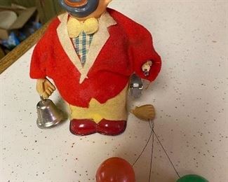 126. Wind Up Japan, with balloons Needs hand surgery. $4