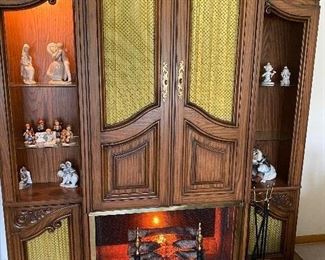 225. Vintage Curio, Doors Open to Pull Down Bar or Serve Cart/ Lighted When Opened. Light Turns Off when Doors Close. Speakers . Electric Crackling Logs, With Fire Place Screen/ Fire Place Tools..7.5 X 7.5 $275.00
