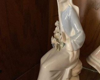 92. Retired Lladro Girl Sitting with Lilies $25