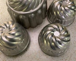29. Set of Alum Swirl Mold with Small Molds $6
