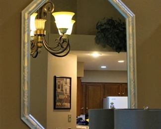 Ornate silver framed mirror.