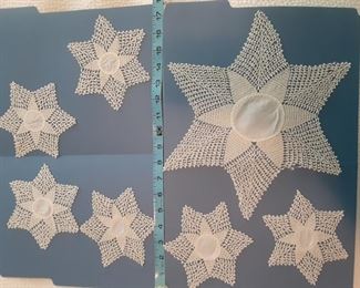 $20 Intricate lace star doilies made in 1927 by owner's grandmother. There is a small area of fraying on the large star (bottom right in photo.  Small stars are about 5" diameter and large about 12" diameter.