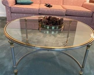 Glass coffee table with brass center piece https://ctbids.com/#!/description/share/408574