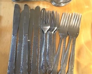 Item #10:  Stainless place setting for 4 plus extras:$8 